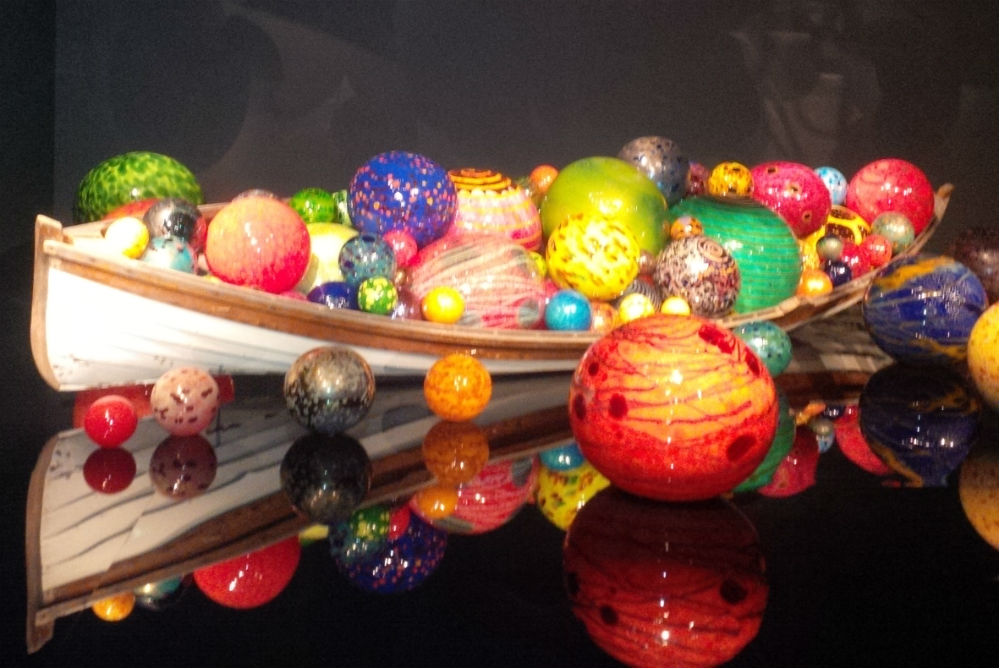 Dale Chihuly canoe with color glass gloes