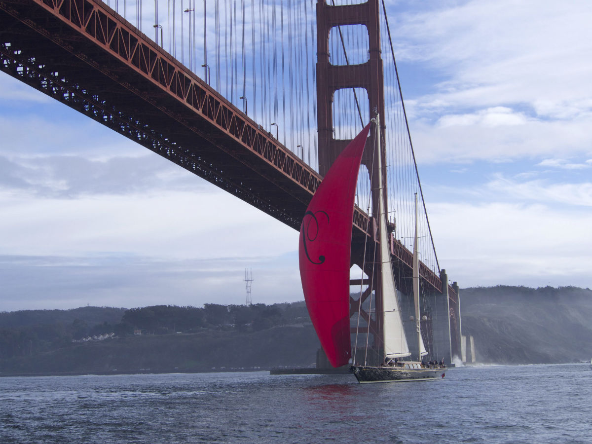Saling Yacht THalia sils under Golden Gate Bridge San Francisco