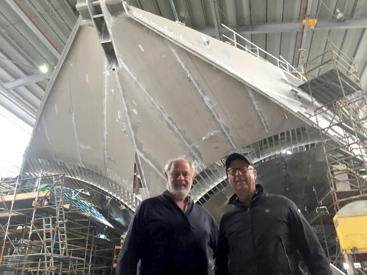 Ron Holland visits Bob Clifford at the Inca facilities in Tasmania Australia with the biggest aluminum construction project in background