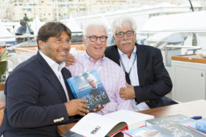 Lamberto Tacoli, Ron Holland and Bruce Brakenhoff with copies of Ron Holland's memoir All The Oceans